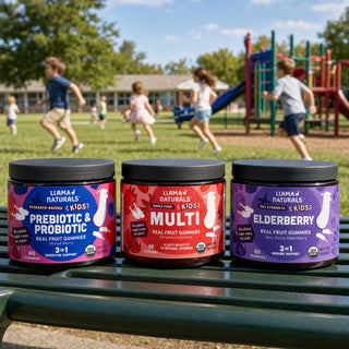 Kids Multi, Pre & Probiotic and Elderberry jars on a school playground bench, children playing behind
