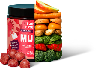 Container of Llama Nature fruit snacks with a stack of fruits and vegetables on a white background